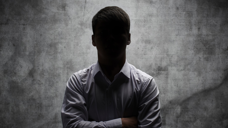 Anonymous man posing with arms crossed