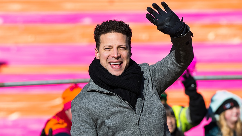 Justin Guarini waves at camera