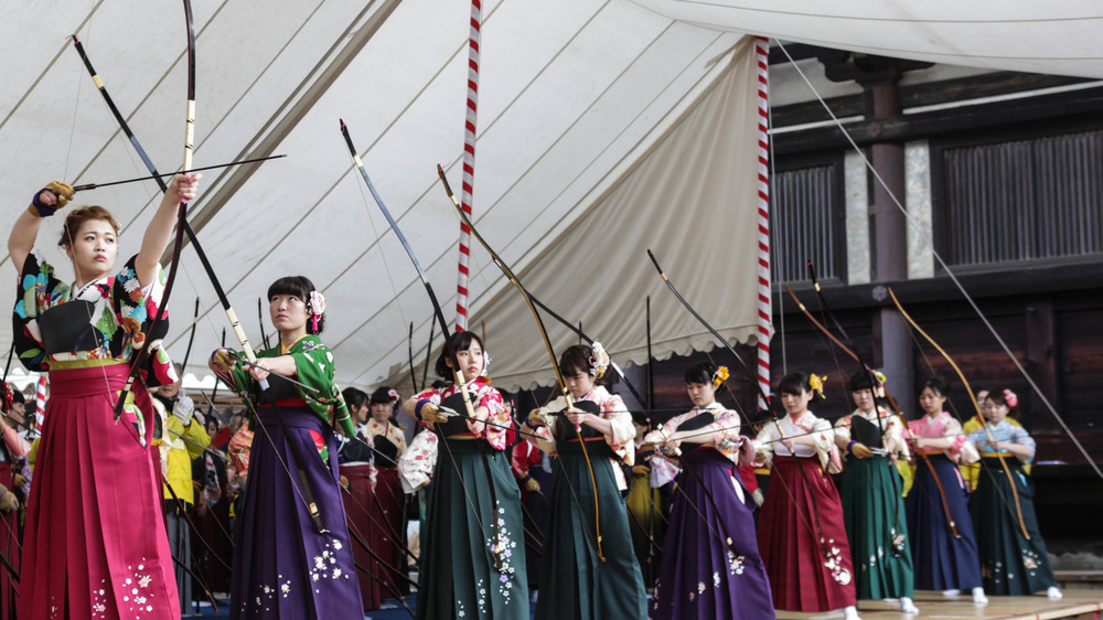 Young women participate in the Toshiya archery competition