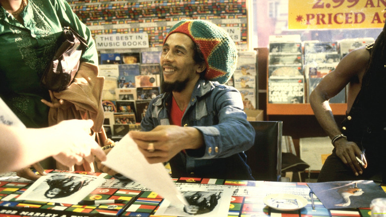 Bob Marley signing autographs