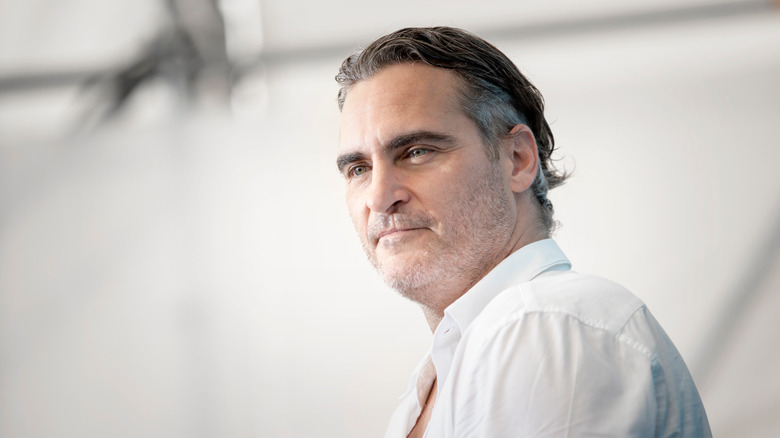 Joaquin Phoenix in white shirt