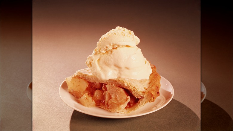 Apple pie and ice cream on plate