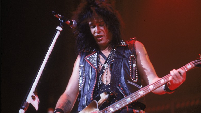 Nikki Sixx playing bass