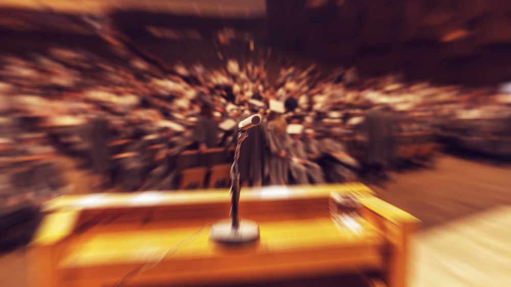 Microphone in front of blurry crowd