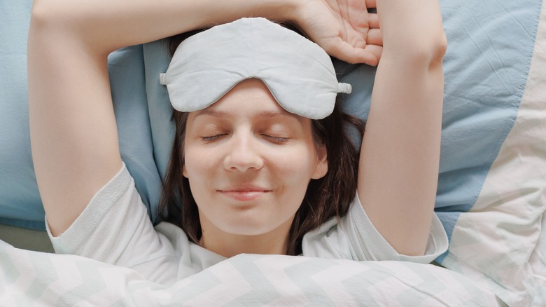 woman sleeping with sleep mask