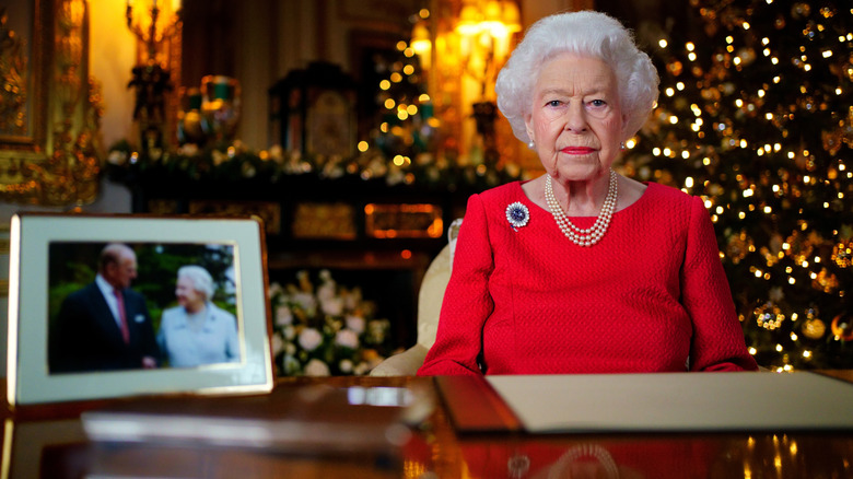 The Queen sitting and looking