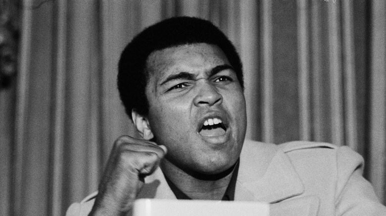 Ali yelling at a press conference