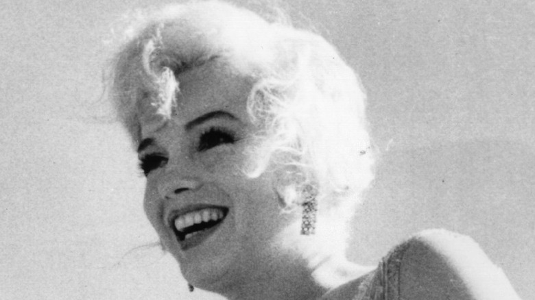 Marilyn Monroe smiles between takes on the set of "Some Like It Hot"