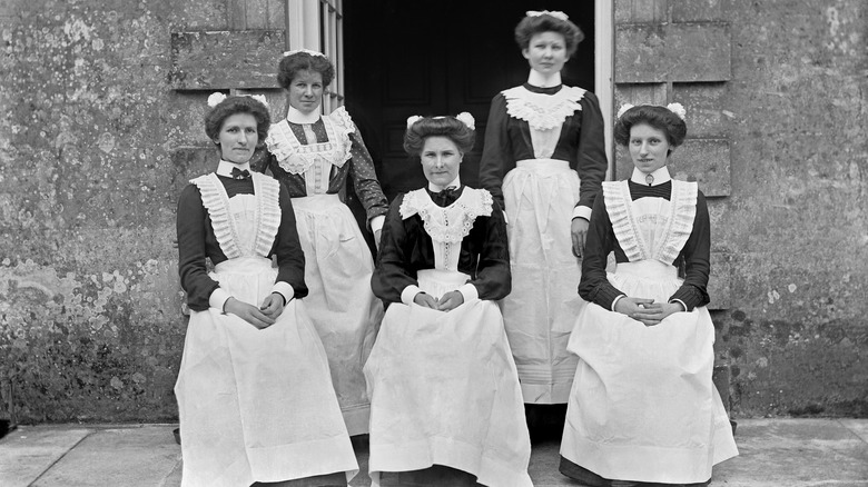 Maids at English stately house posing for a photo