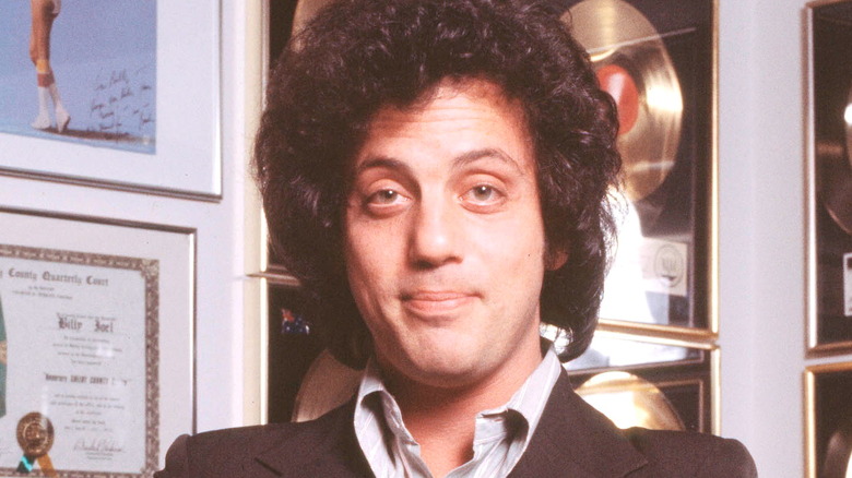 Billy Joel with gold records