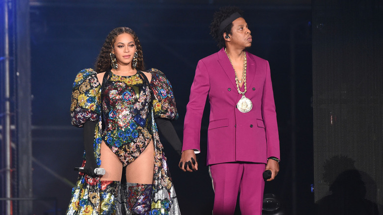 Beyonce and Jay-Z holding hands on stage