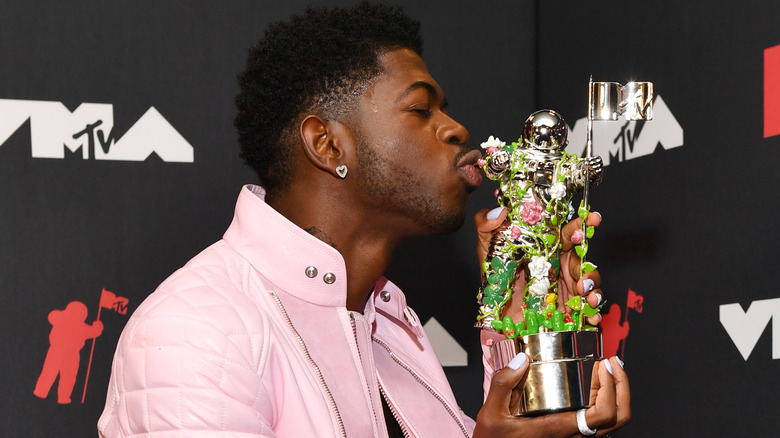 Lil Nas X kissing MTV Award