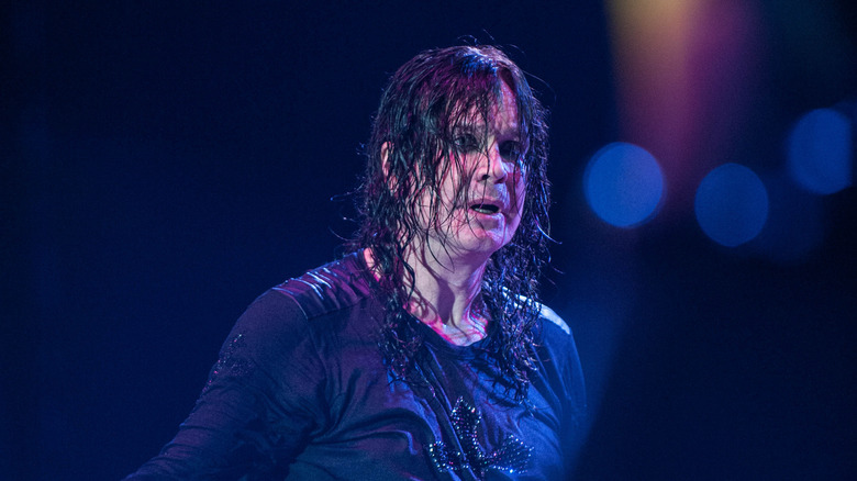 Ozzy Osbourne on stage wet