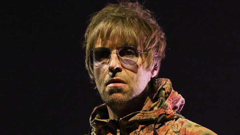 liam gallagher sneering on stage