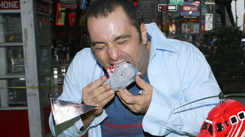 Joe Rogan eating cake at Fear Factor event