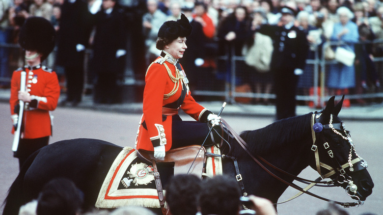 Queen Elizabeth II rides Burma during the Trooping of the Colour ceremony at Buckingham Palace in June, 1985 in London