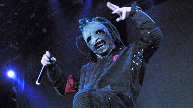 Slipknot's Corey Taylor gesturing on stage a the Tweeter Center in 2001