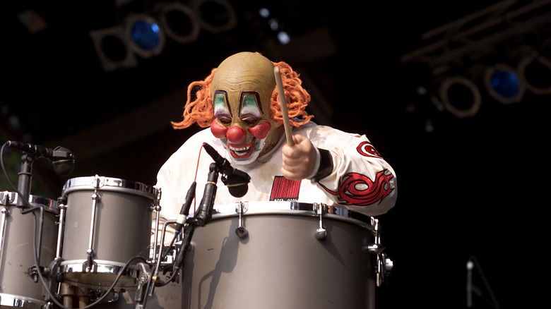 Slipknot's Clown playing drums on stage in 2000