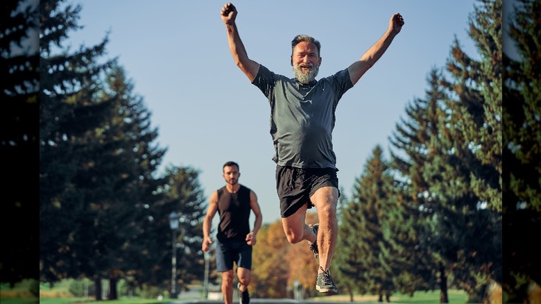 Old man beating a young man on a run