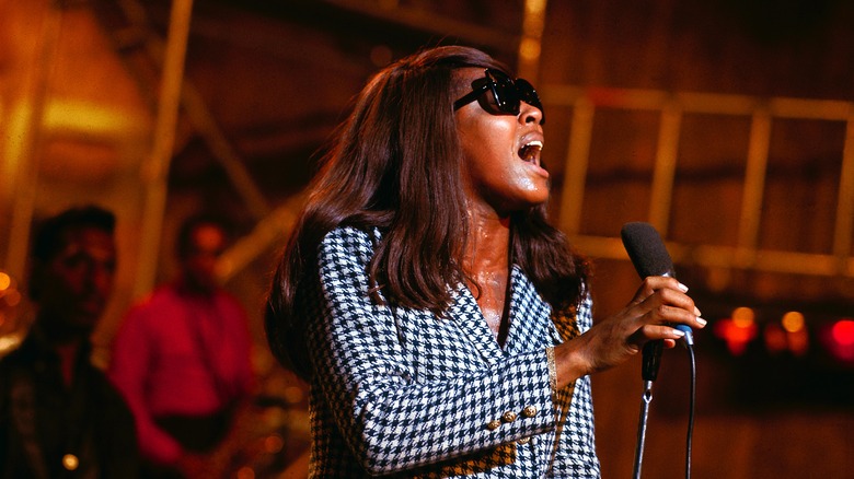 Tina Turner long hair singing on stage