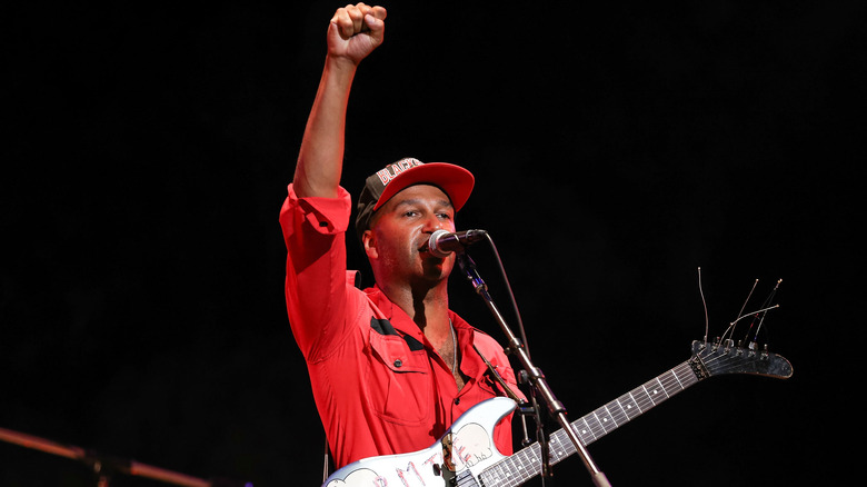 Tom Morello holding up a fist