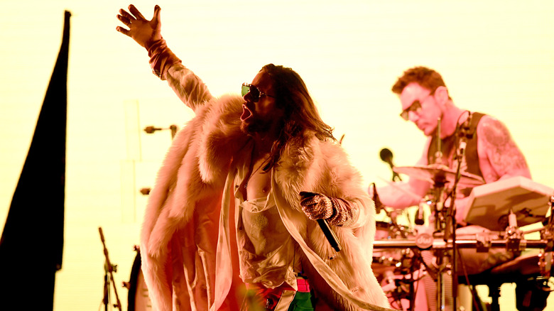 Jared Leto performing in fur coat