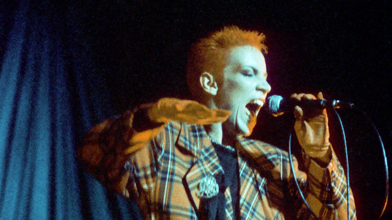 Annie Lennox in tux on stage