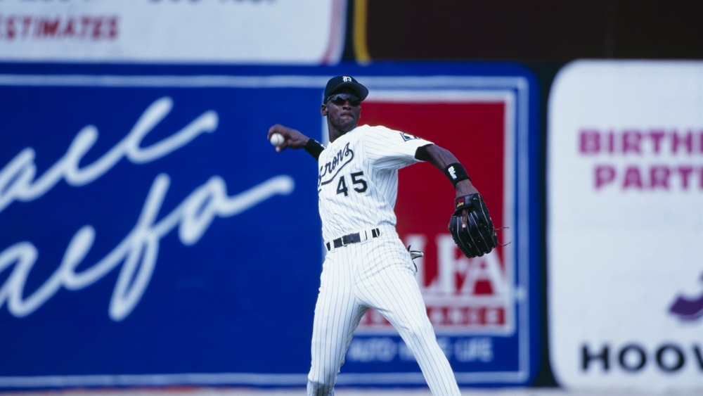 Michael Jordan throwoing a baseball