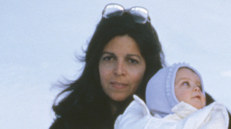 Christina Onassis holds her daughter