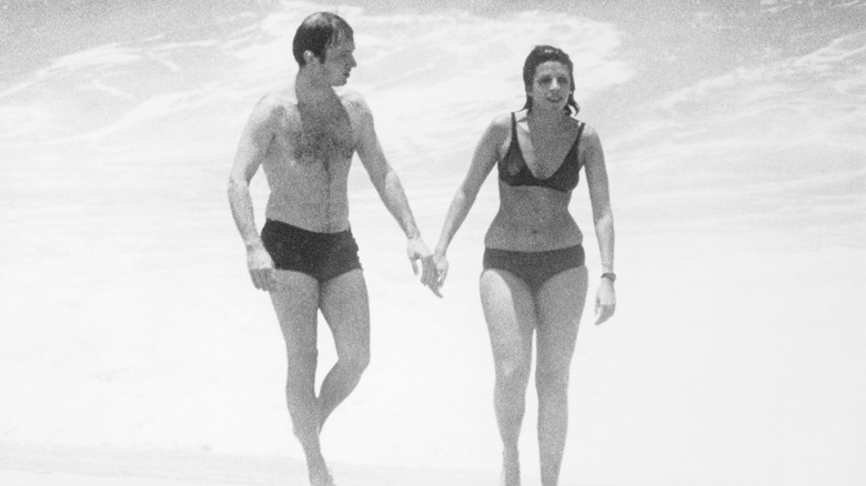 Sergei Kauzov and Christina Onassis hold hands