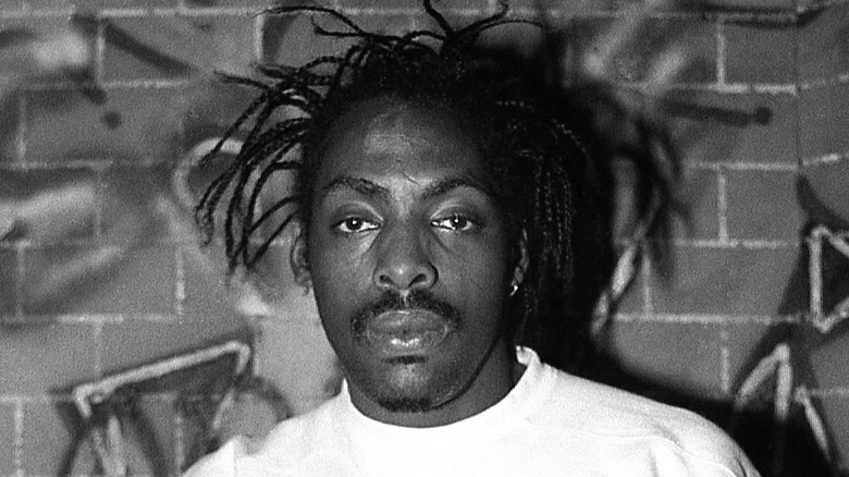 Coolio wearing a white shirt