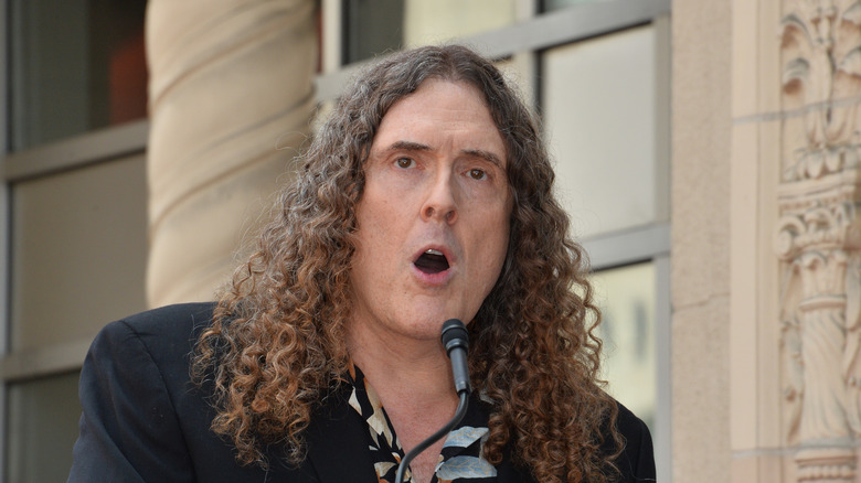 Weird Al Yankovic giving a speech