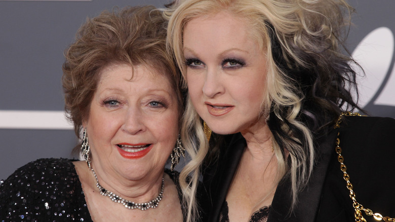 Cyndi Lauper and mother posing at event