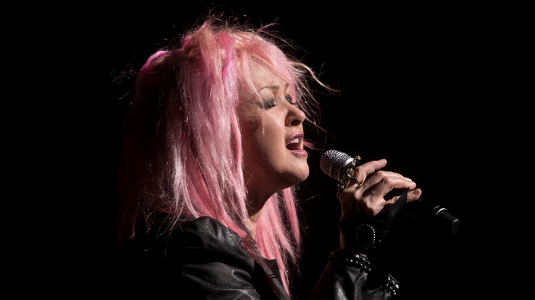 Cyndi Lauper performing on stage pink hair