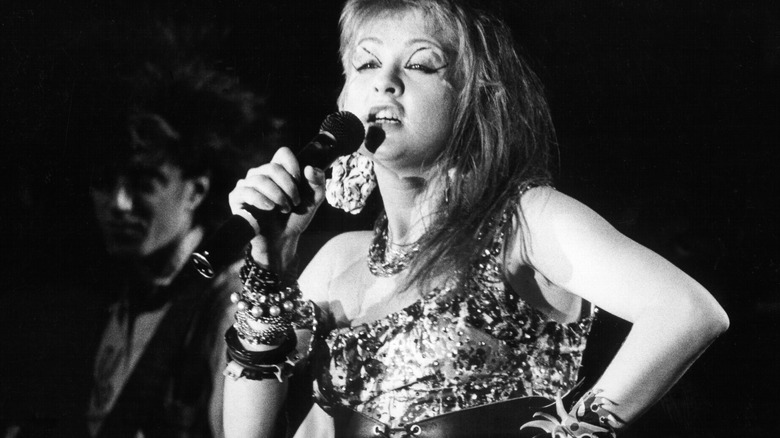 Young Cyndi Lauper singing 1970s high contrast