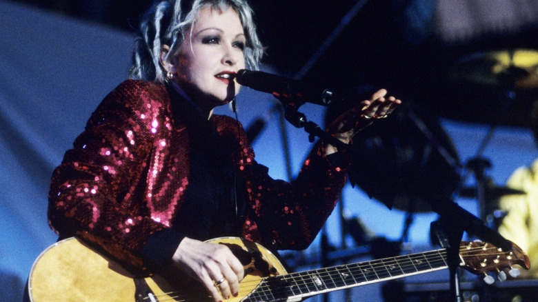 Young Cyndi Lauper singing with guitar