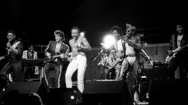 Earth, Wind & Fire on stage instruments spotlit