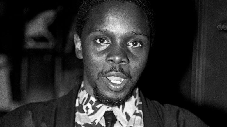 Philip Bailey talking white shirt and tie dark jacket