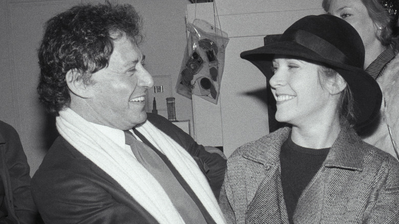 Eddie Fisher and Carrie Fisher smiling at each other