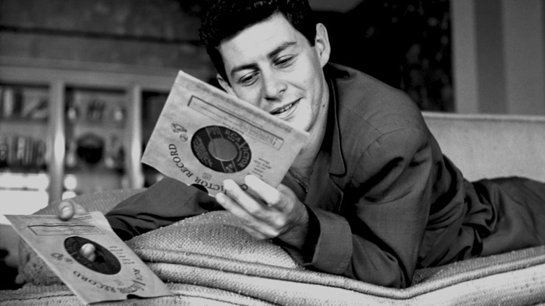 Eddie Fisher looking at records