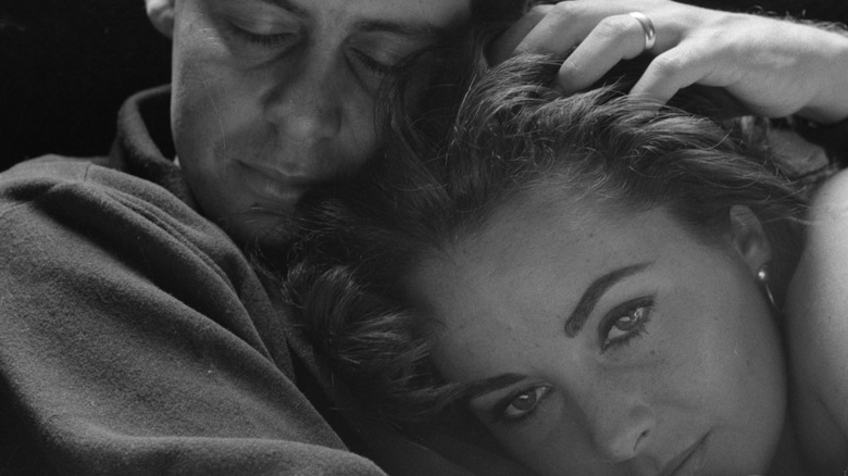 Eddie Fisher cuddling with Elizabeth Taylor