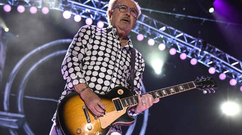 Mick Jones performing on stage