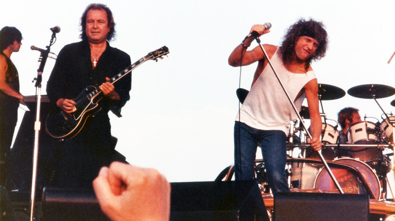 Mick Jones and Lou Gramm performing