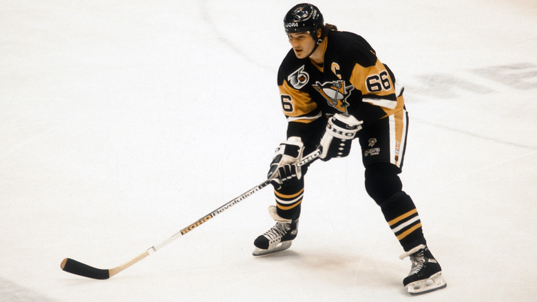 Mario Lemieux holding hockey stick