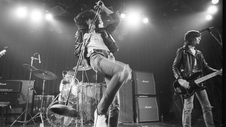 Joey Ramone performing on stage jumping