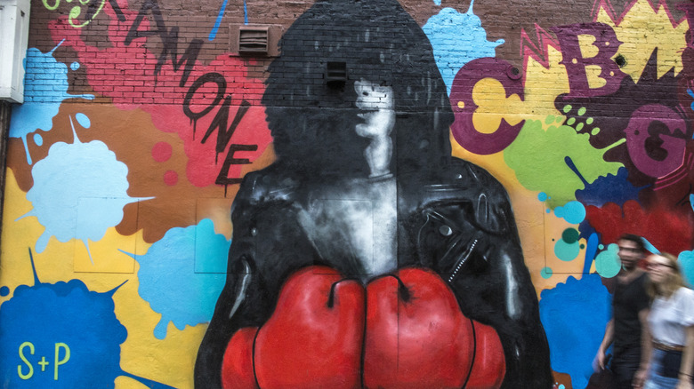 mural featuring Joey Ramone red boxing gloves