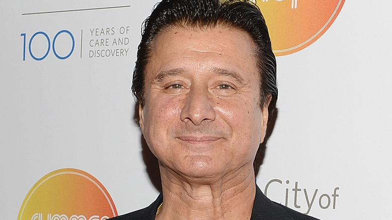 Steve Perry grimacing