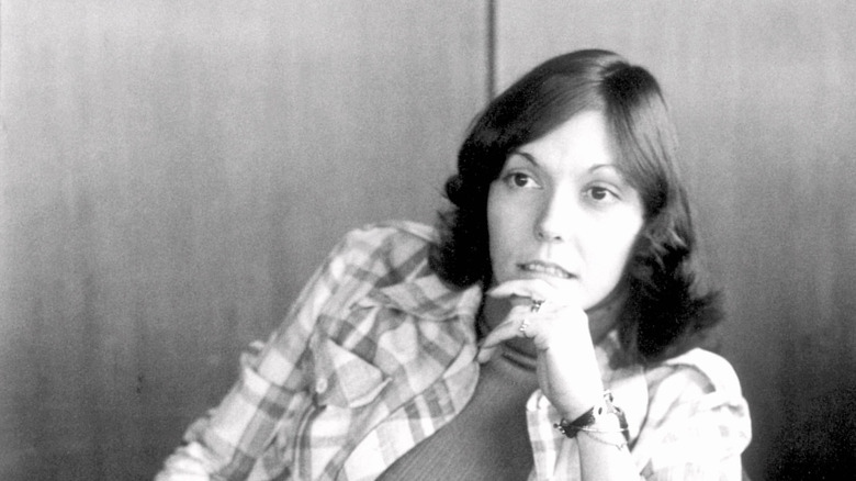 Karen Carpenter sitting with hand to chin