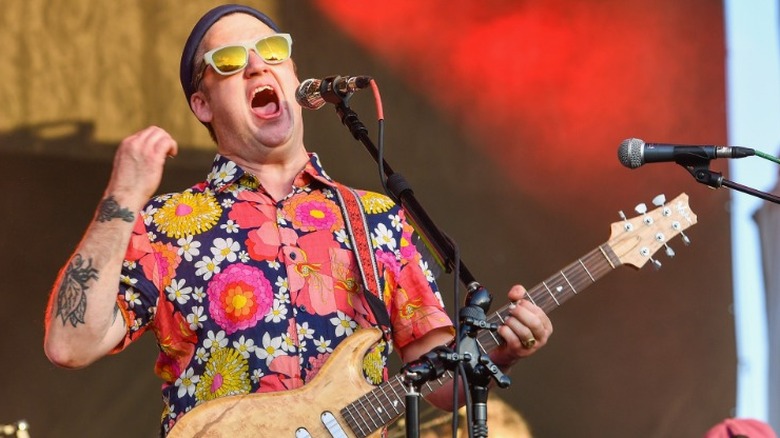 Isaac Brock singing with guitar