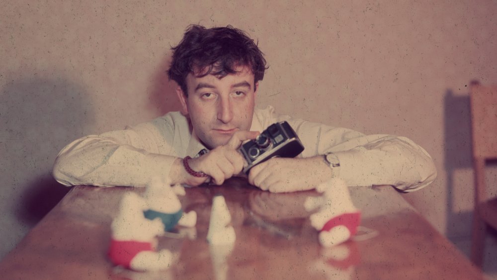 Peter Sellers with camera and toys